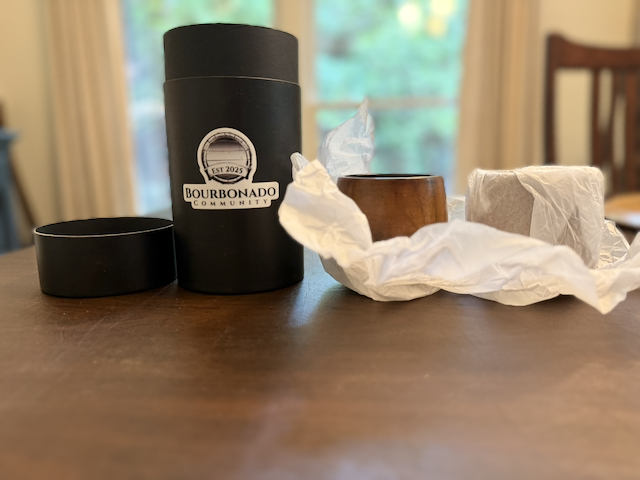 Two handcrafted wooden bourbon cups with a pour of bourbon
